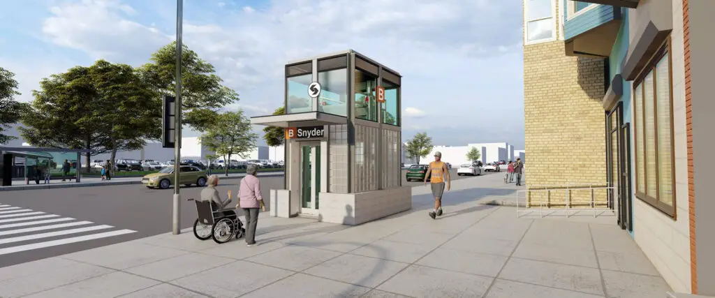 A person in a wheelchair approaches an elevator entrance labeled “S” at the B Snyder subway station, showcasing thoughtful civic design; another person walks nearby on a wide, accessible sidewalk in this urban street setting.