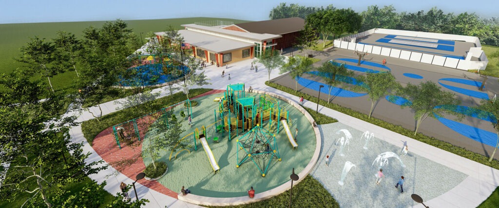 Aerial view of a modern playground in Philadelphia with a climbing structure, splash pad, sports courts, and nearby building surrounded by trees and green space. Children and adults enjoy the outdoor facilities in this vibrant urban setting.