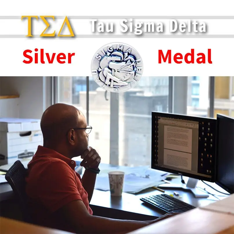 A person sits at a desk in an educational Philadelphia office, looking at a computer screen. Above, the text reads Tau Sigma Delta Silver Medal with the Greek letters ΤΣΔ and a silver medal logo. Light from a window illuminates the workspace.