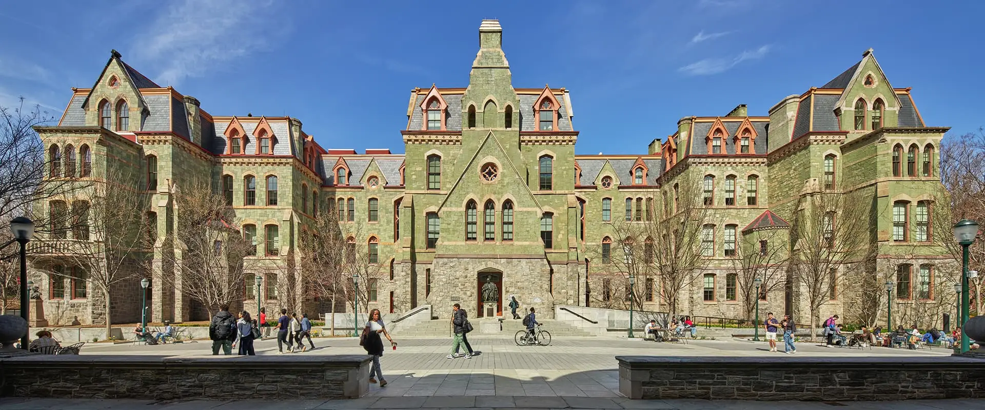 University of Pennsylvania College Hall facade and plaza under a blue sky.