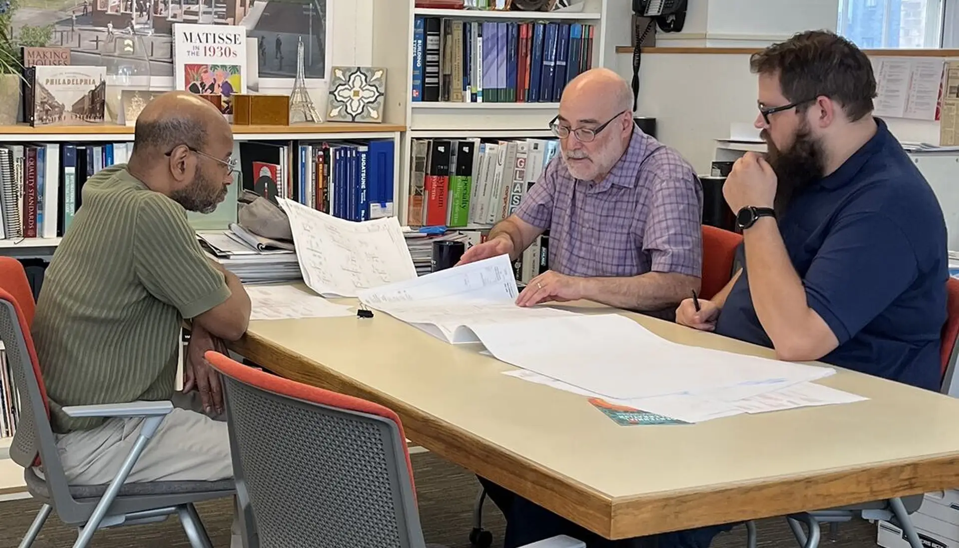 KMA team collaborating around a table